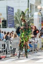 Participants of the annual carnival of Adloyada walking on stilts, dressed in fabulous costumes in Nahariyya, Israel Royalty Free Stock Photo