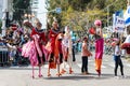 Participants of the annual carnival of Adloyada walking on stilts, dressed in fabulous costumes in Nahariyya, Israel Royalty Free Stock Photo