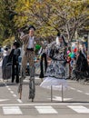 Participants of the annual carnival of Adloyada walking on stilts, dressed in fabulous costumes in Nahariyya, Israel Royalty Free Stock Photo