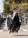 Participants of the annual carnival of Adloyada walking on stilts, dressed in fabulous costumes in Nahariyya, Israel Royalty Free Stock Photo