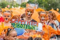 Participants of annual festive Tiger Day. Kids hold tiger drawing with the inscription `Take care of animals.`