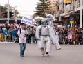 Participants at ÃÂarnival dressed in robots are walking along st