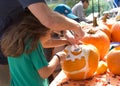 Participants carving pumpkins at Senator Scott Wiener`s Halloween Pumpkin Carving Event Royalty Free Stock Photo