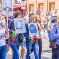 Participants in the column `Immortal Regiment` with portraits of relatives killed in World War II
