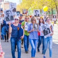 Participants in the column `Immortal Regiment` with portraits of relatives killed in World War II