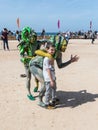 Participants of the festival dedicated to Purim dressed in fairy-tale costumes are photographed with a visitor in Caesarea, Israel