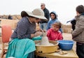 Participants of festival teaches girl to make pitcher of clay Royalty Free Stock Photo