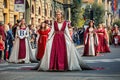 Participants in historic dresses on Medieval Parade in Alba, Italy.