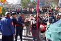 Participants in the opening ceremony of Chinese New Year at Portsmouth Square in Chinatown, politicians lighting firecrackers