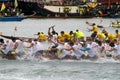 Participants paddle their boats