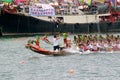 Participants paddle their boats