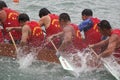 Participants paddle their dragon boats