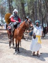 Participants in the reconstruction of Horns of Hattin battle in 1187 one sits on a battle horse, and the second one holds a horse