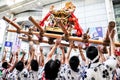 Participants of Tenjin Matsuri worships the golden shrine, July