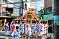 Participants of Tenjin Matsuri worships the golden shrine, July