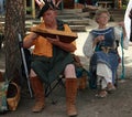 Participants wearing typical clothes singing and playing during The Annual Renaissance festival in Colorado
