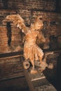 Wooden angel defeating a demon, Lublin, Poland