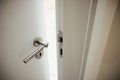 Partly opened door with a handle Royalty Free Stock Photo
