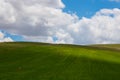 Partly shadows on the meadow and cloudy sky