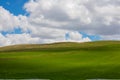 Partly shadows on the meadow and cloudy sky Royalty Free Stock Photo