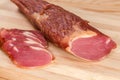 Partly sliced dry-cured pork tenderloin, fragment close-up Royalty Free Stock Photo