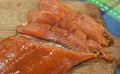 Partly sliced smoked salmon fillet skin-on