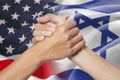 Partnership hand with american and israel flags