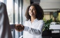 Partnership handshake in modern creative office, Business people shaking hands while working, Successful business concept Royalty Free Stock Photo