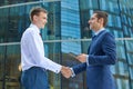 Business handshake outdoor on office center background. Royalty Free Stock Photo