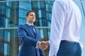 Business handshake outside the business center.