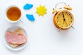 Parts of day. Morning. Time for breakfast. Tea, sandwich near alarm clock, sun and clouds cutout on white background top Royalty Free Stock Photo