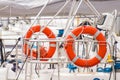 Parts of yacht, Orange lifebuoy on sailboat, safety travel concept