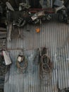 Parts of the old car and Several rubber hoses were hanged by the galvanized wall. Royalty Free Stock Photo