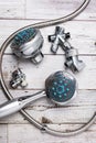 Parts of old shower and bathtub faucet on a wooden table Royalty Free Stock Photo