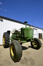 Parts of an old tractor missing under the hood