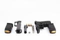 Parts of .45 semi automatic pistol handgun with bullets on white background , Gun disassembled Royalty Free Stock Photo