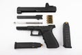 Parts of .45 semi automatic pistol handgun with bullets on white background , Gun disassembled Royalty Free Stock Photo