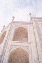 Some parts of arches and pillars of Taj Mahal on sky background, Agra, India