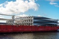 Parts of windfarm on the deck of cargo ship.