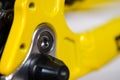 Parts of yellow bicycle on a studio white background. Close up details Royalty Free Stock Photo