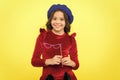 Party accessories concept. Child with long hair and fashionable hat. Birthday party photo booth props. Kid girl cheerful