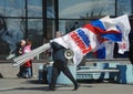 Party activist has a megaphone and the flags