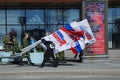 Party activist has a megaphone and the flags