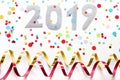 2019 party background with confetti and paper streamers on white background.