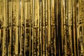 Party Background. Decor made of gold foil, tinsel and candy. Festive and cheerful mood