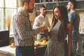 Party with best friends. Group of cheerful young people enjoying home party with snacks and drinks while communicating Royalty Free Stock Photo