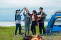 Party Camping.  Group asian family and friends travel enjoy party and roasted sausages relax Royalty Free Stock Photo