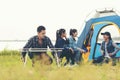 Party Camping.  Group asian family and friends travel enjoy party and roasted sausages relax in vacations. Royalty Free Stock Photo