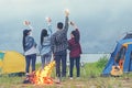 Party Camping.  Group asian family and friends travel enjoy party and roasted sausages relax in vacations Royalty Free Stock Photo