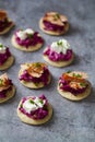 Blinis with creamy beetroot, goat cheese and hot smoked salmon